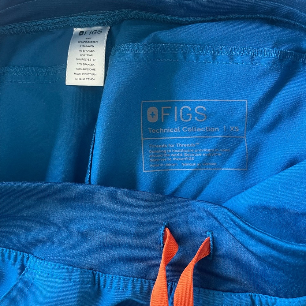 Figs Technical Collection Alps blue XS Scrub Pants with Orange drawstrings.